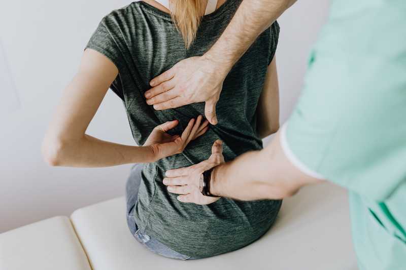 Osteopath treating a patient